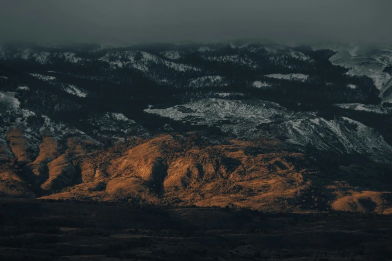 mountains are shown with clouds in the sky