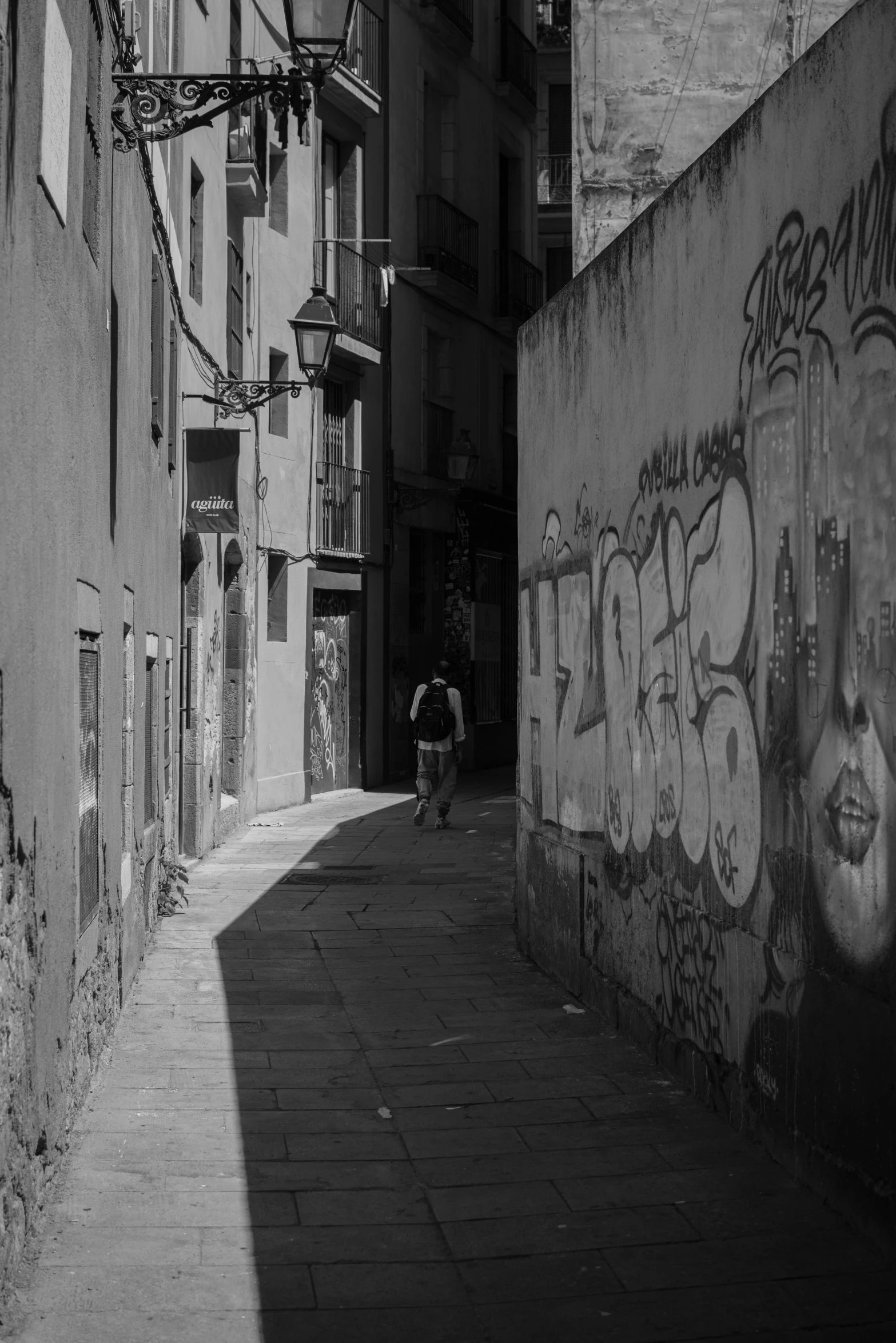 a man riding a skateboard down a side walk