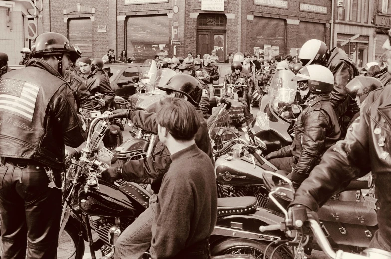 people in line to buy motorcycles outside buildings