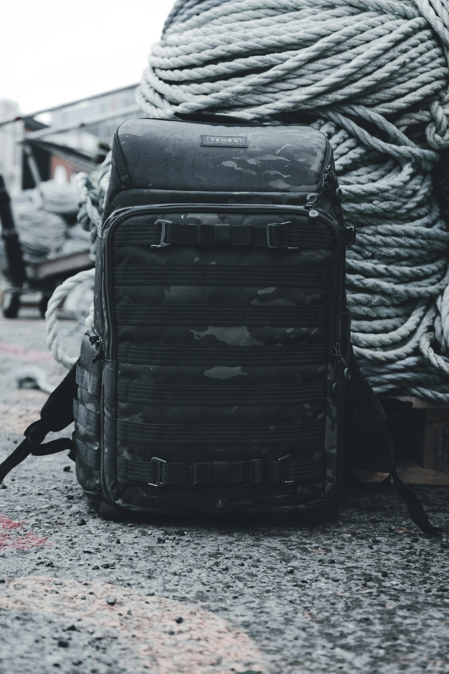 a backpack with some rope on top of it