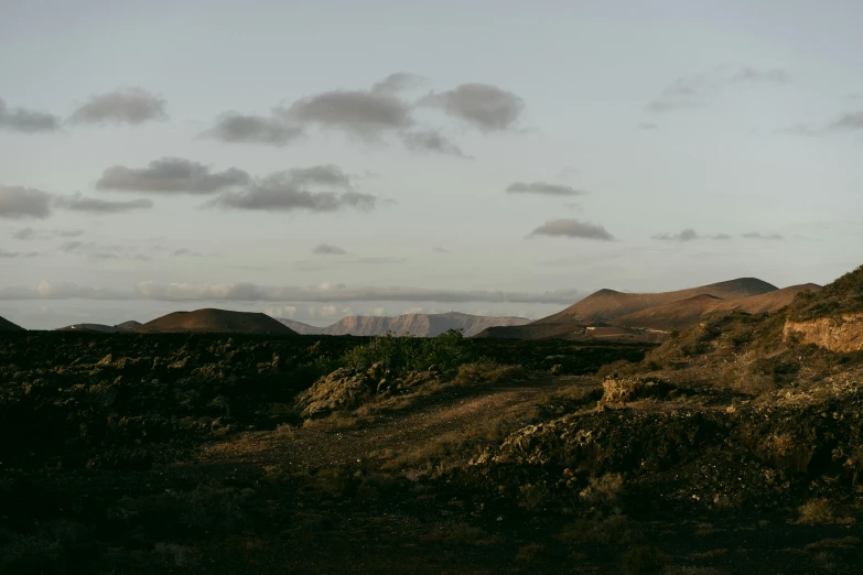 a mountain landscape with low clouds