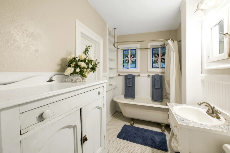 a bathroom that has a bathtub and sink in it