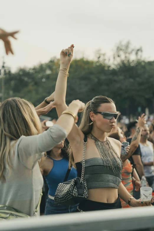 people dancing and having fun together in a crowd