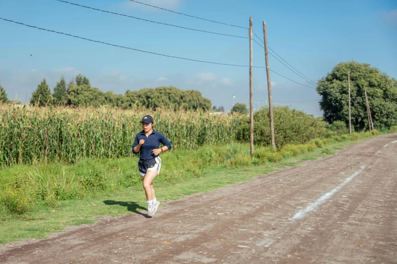 a man jogging in a rural area during the day