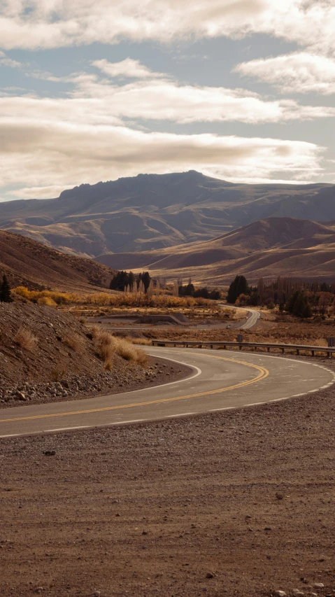 a road winding into the middle of a large land