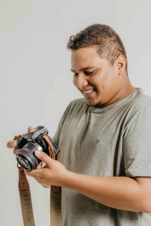 a man holding up his camera to take a picture