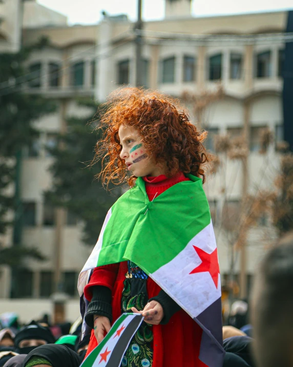 a woman in costume with painted face, holding an flag