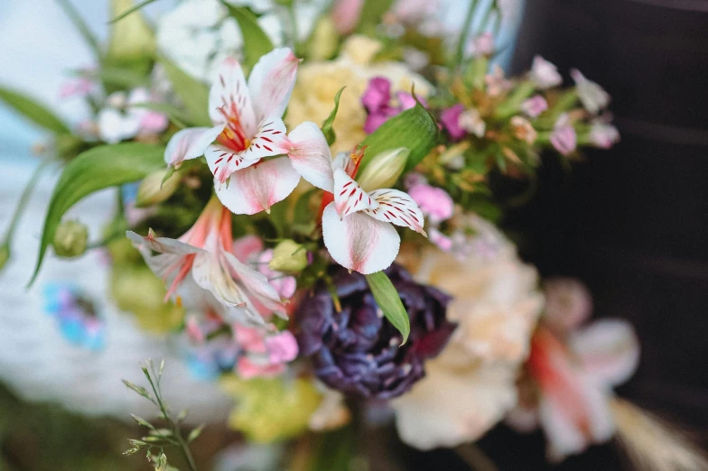 a bunch of flowers that are on top of a table