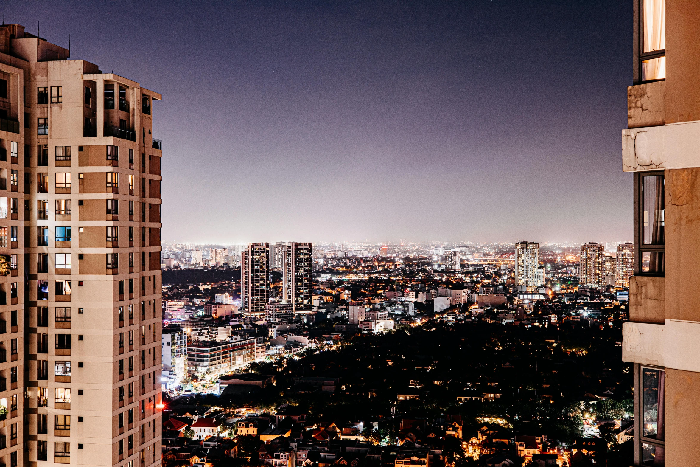 a city view at night looking at some buildings