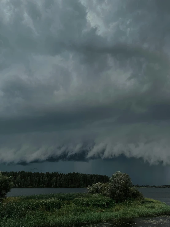 a big cloud that is covering a lot of land and water