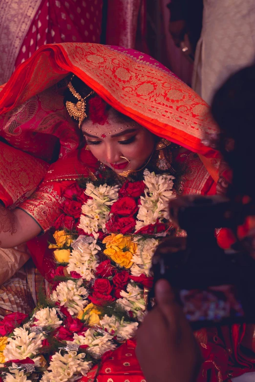 a young woman dressed in red poses for the camera