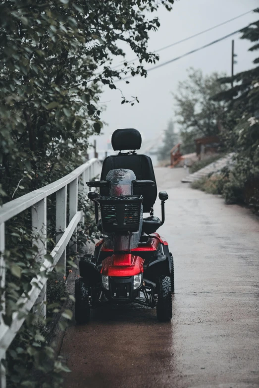 a person riding an atv along a wet road