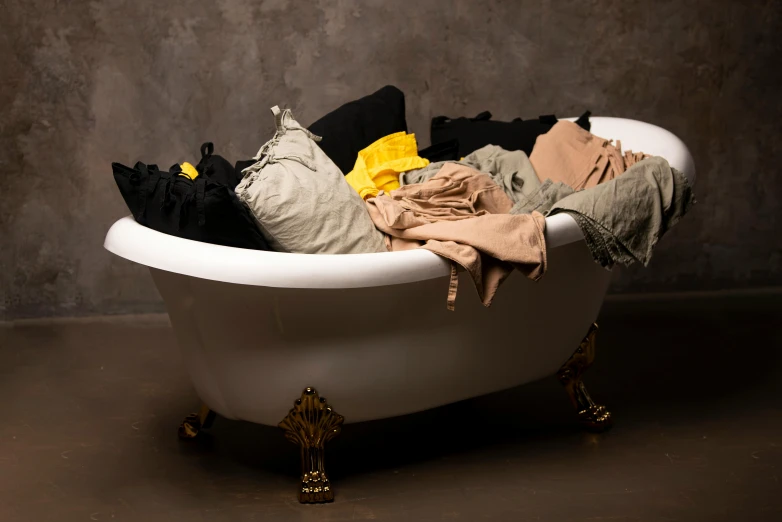 there is a tub filled with clothes inside of it