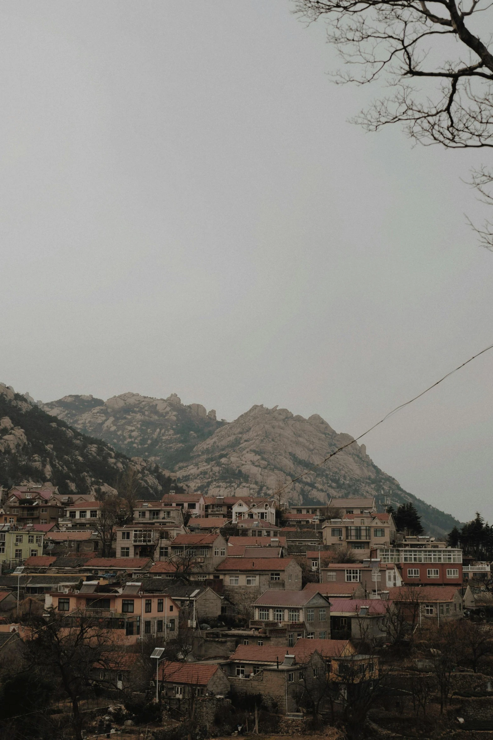 town in the distance, with many buildings on top