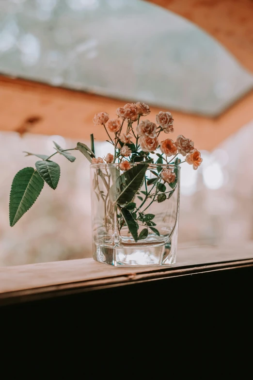 a small vase with some flowers in it