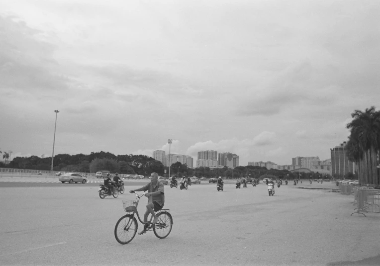 a person riding a bike on the beach