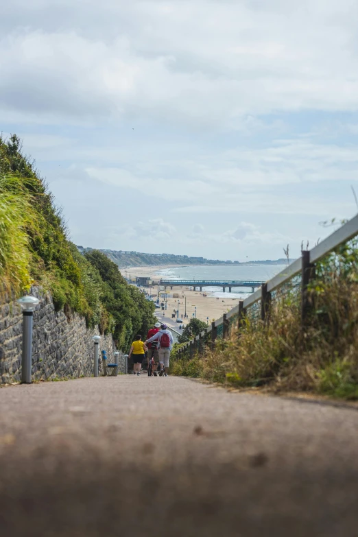 a woman is riding her bicycle down the road