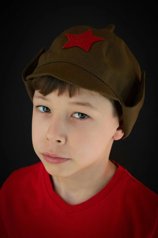 a  wearing a red t shirt with a green hat