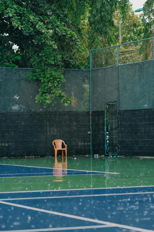 a chair that is on a blue court