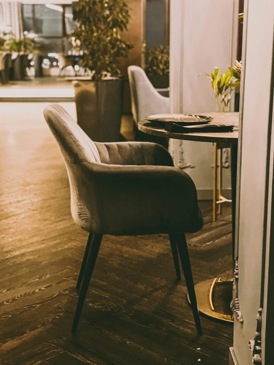 a wooden floor with chairs and tables and a street