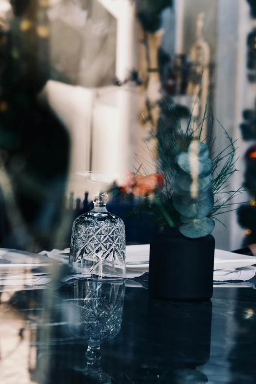 the small clear glass vase holds a succulent plant