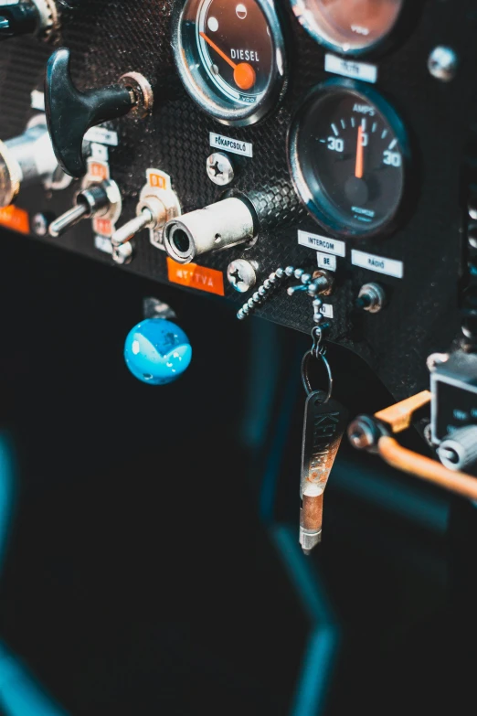 the dashboard of a plane with different gauges and tachometers