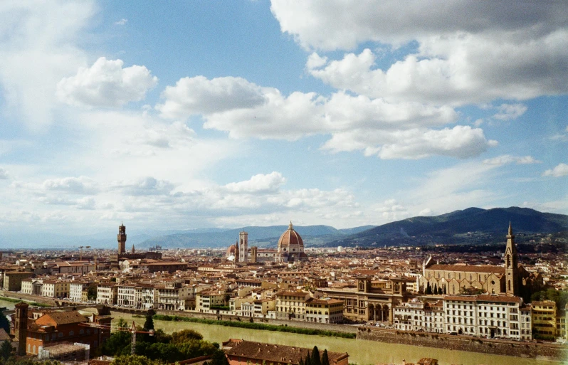 a city is shown with a large amount of clouds above