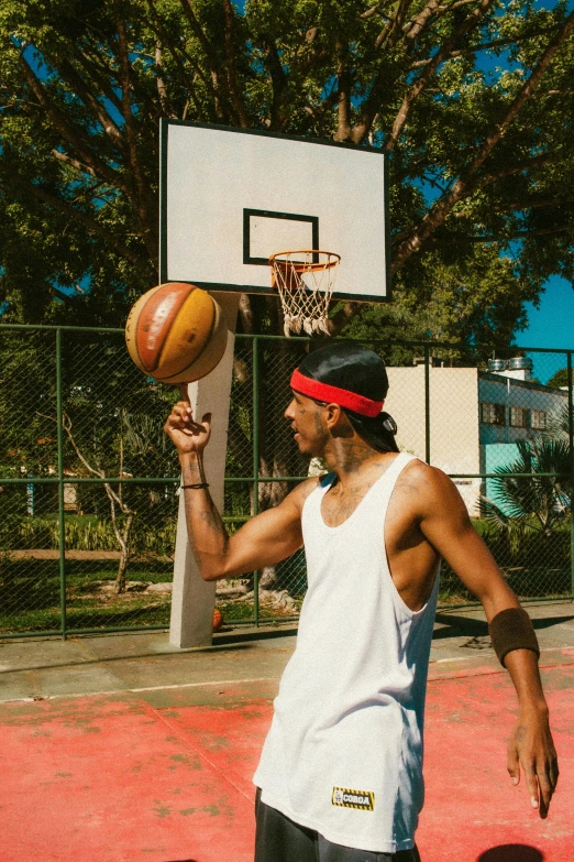 a man about to dunk a basketball into the hoop