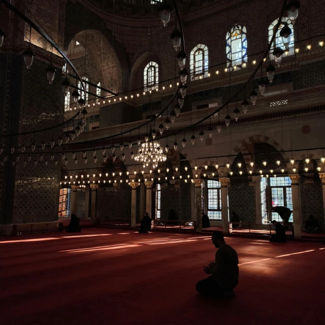 a person kneeling on the floor in an old building