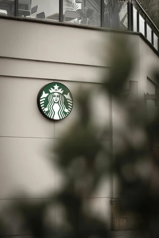 the starbucks logo on the side of a building