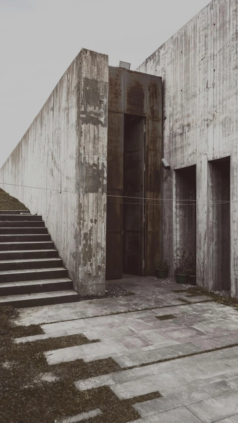 stairs leading up to two building with no doors