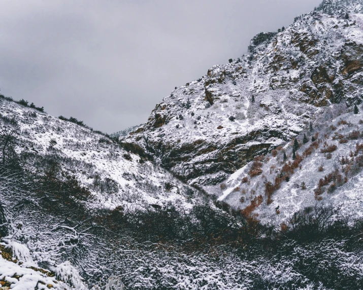 the view from an overlook point on snowy mountaintops