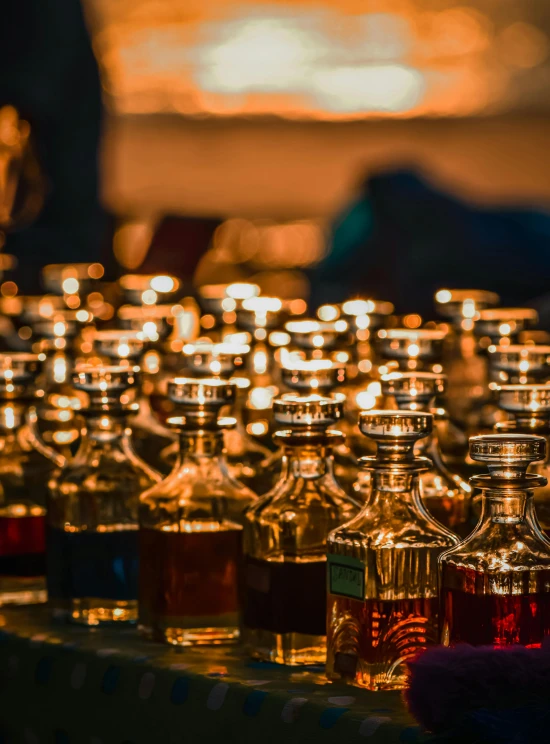 several small glass bottle lined up on a table