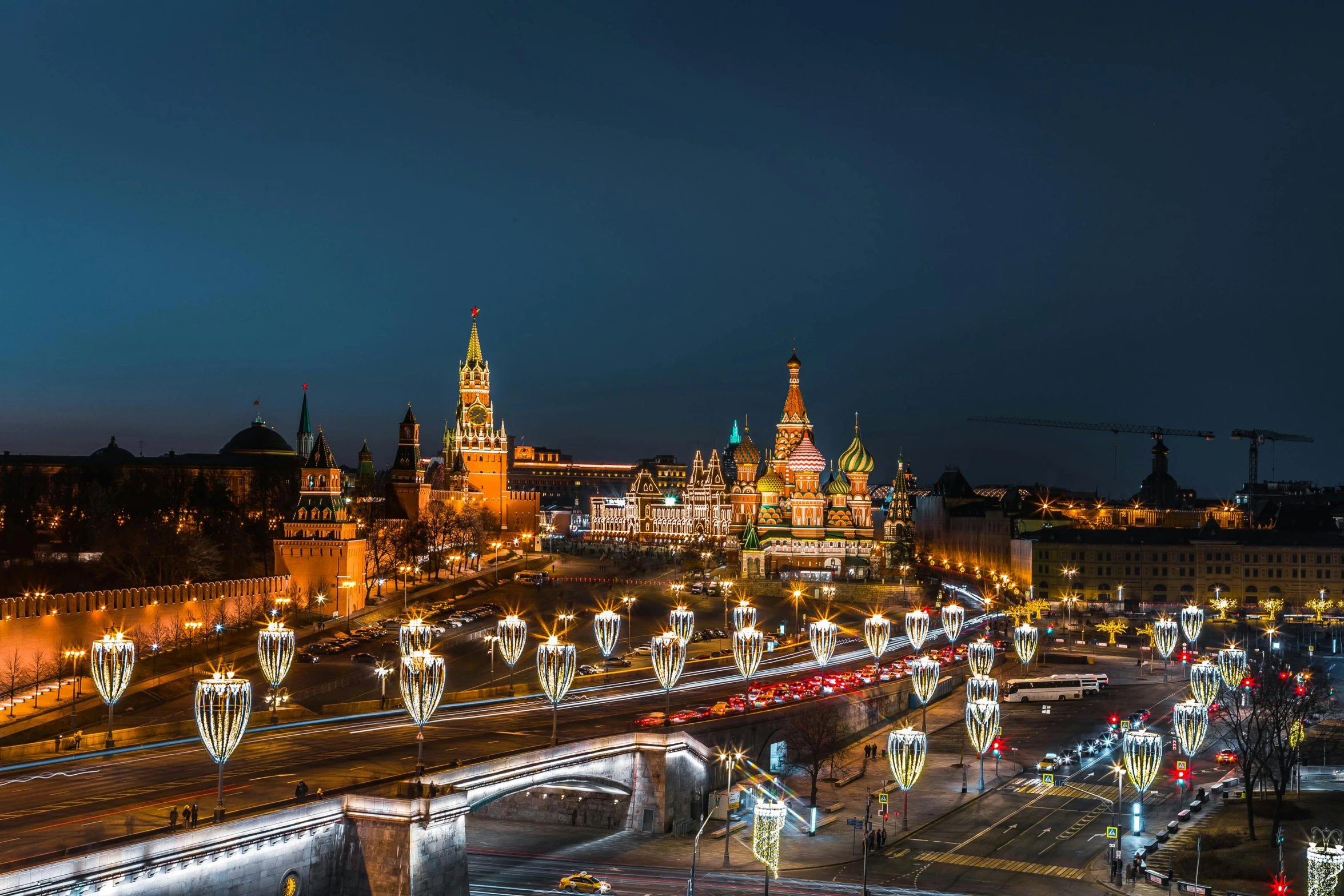 a view of several large and tall buildings at night