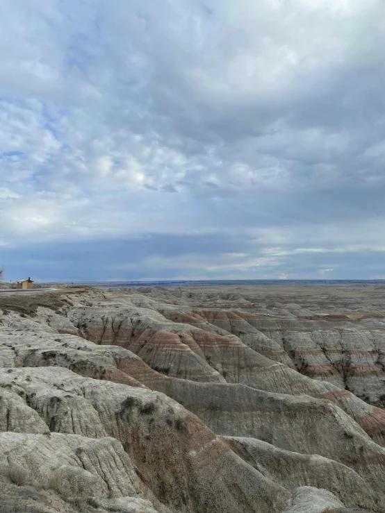 a view of a man is taking a po on top of an empty plateau