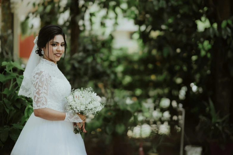 a bride and groom standing next to each other