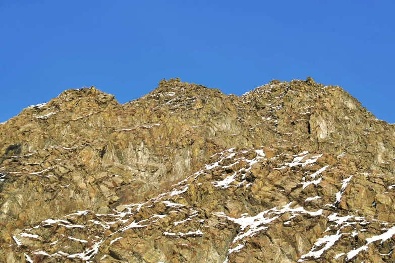 a mountain covered in snow and frost on top