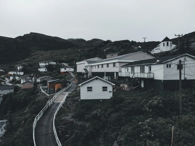 a mountain town on a foggy day