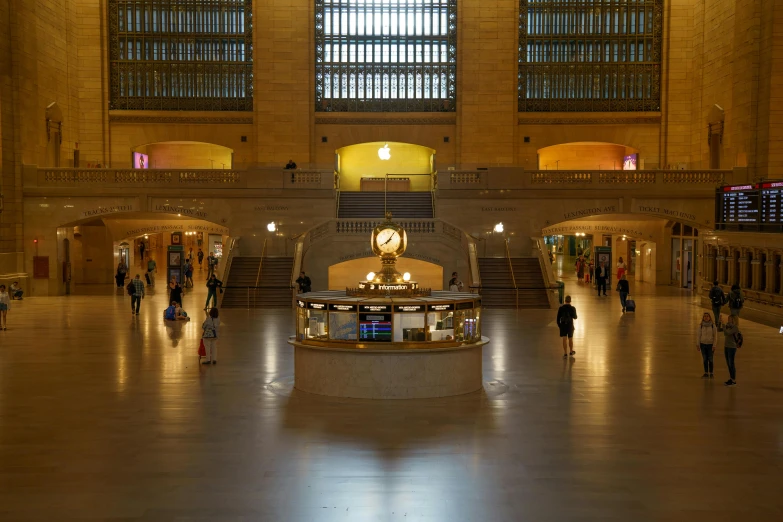 the interior of an empty subway station with a bunch of people