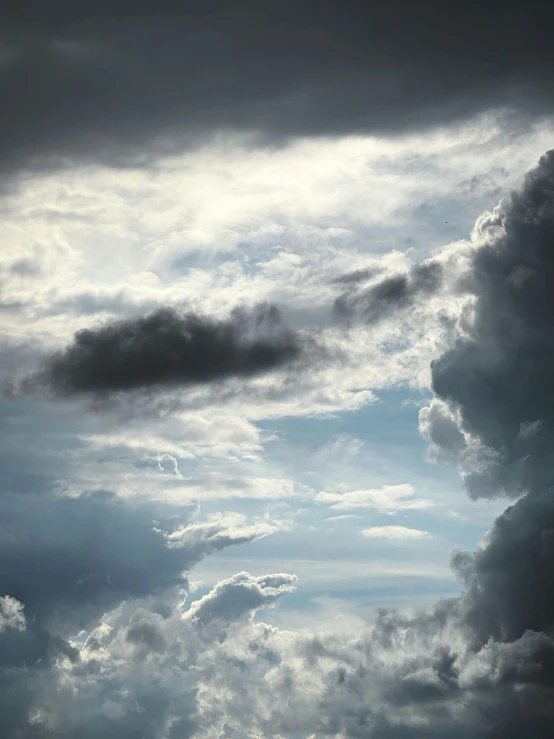 plane in the sky with dark clouds