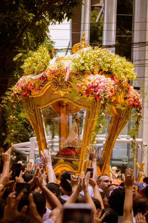 the crowd is throwing their hands up at the float