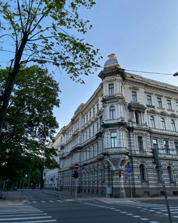 a large building that is standing on the side of the street