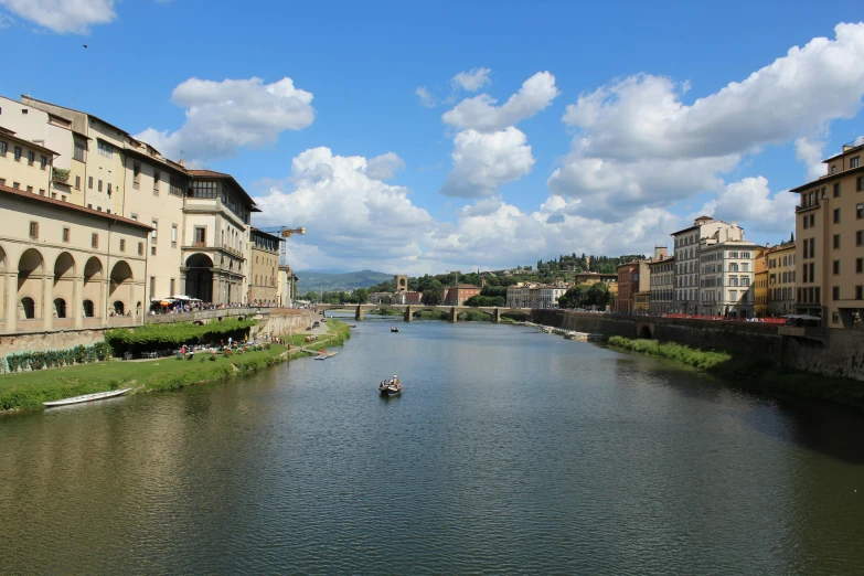 the river runs through town with tall buildings