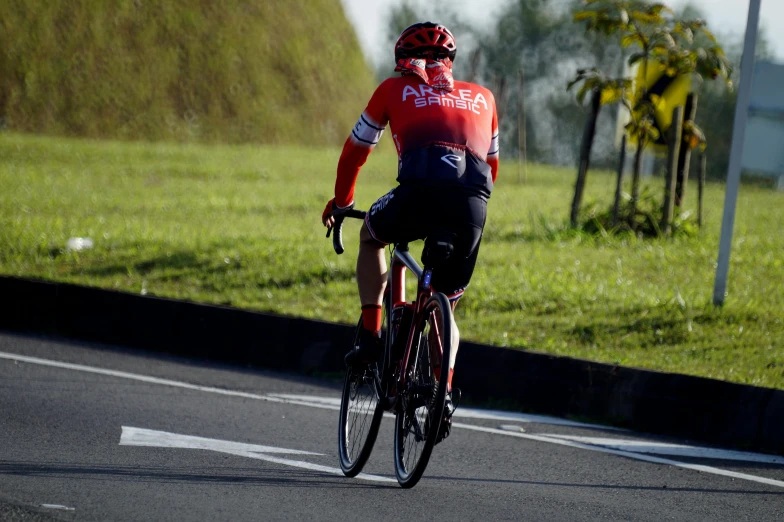 a person riding on a bike on a road