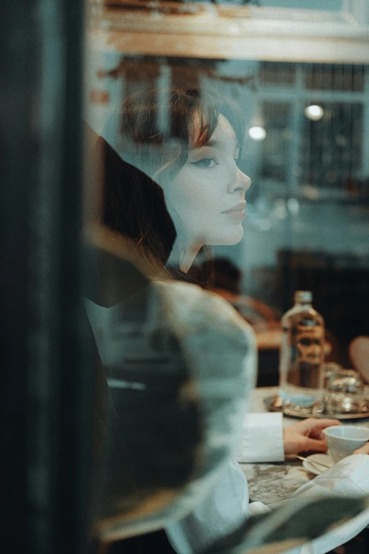 a blurry image of two women drinking alcohol