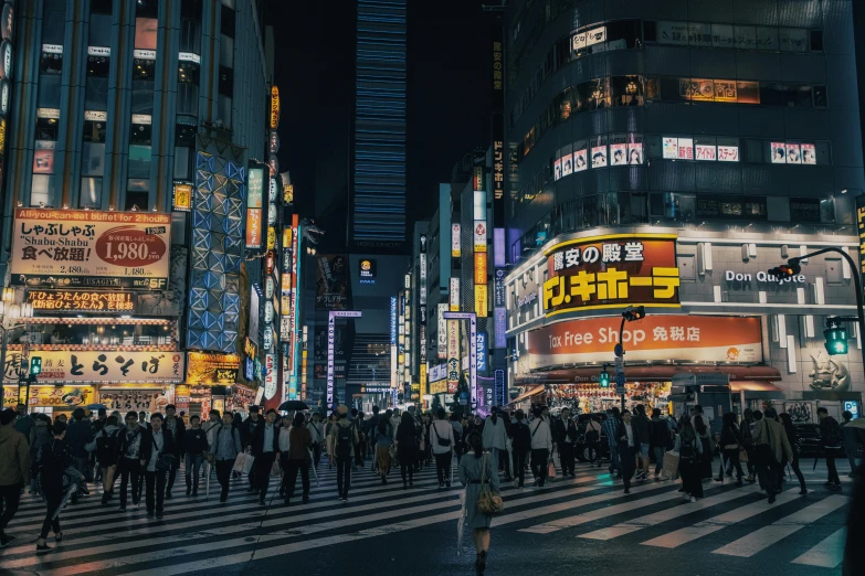 a large city with many lights and people on the street