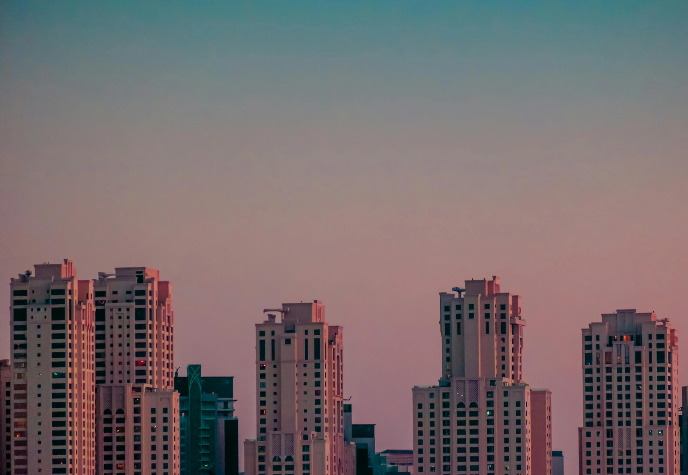 an airplane that is flying over some buildings