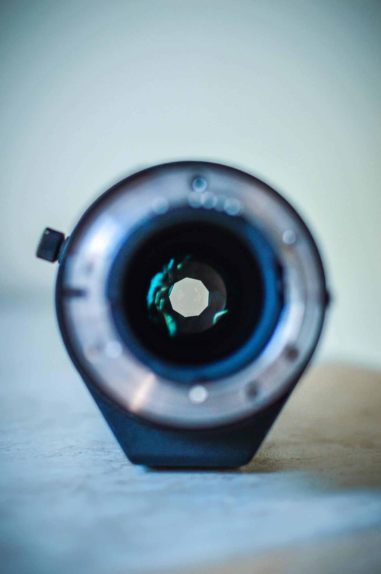 a camera lens sitting on a table that is in close up