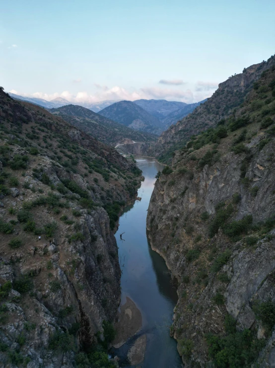 view of a river near mountains, and from above