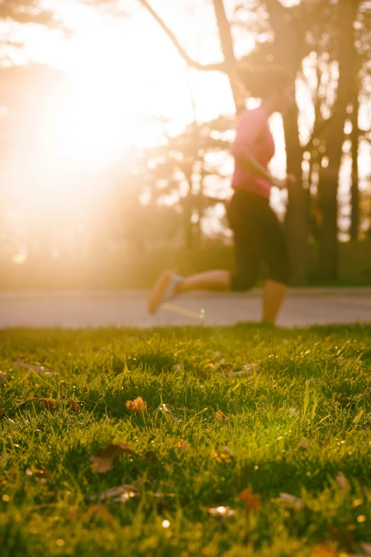 a person is running in a field of grass